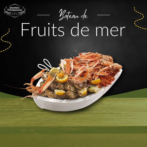 Bateau fruits de mer gourmet platter with oysters, langoustines, gambas, bulots, and crab claws on ice