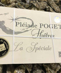 Boîte Pléiade Poget Huîtres La Spéciale sur un lit d’huîtres fraîches naturelles